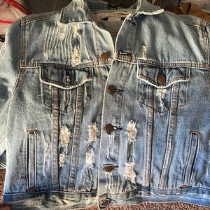 Jean jacket with rips very cute